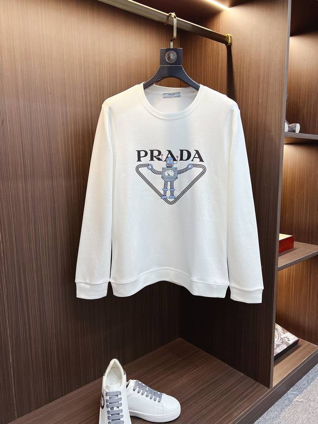 PRADA 普拉达 2025新春 长袖圆领T恤 高端定制经典系列，时尚有型 圆领款式，简单大方，胸前经典品牌高档LOGO设计 采用高档内里保暖极佳 可防静电手感